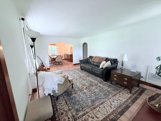 3628 Rau Rd, West Branch, MI 48661 - living room featuring arched walkways and wood finished floors