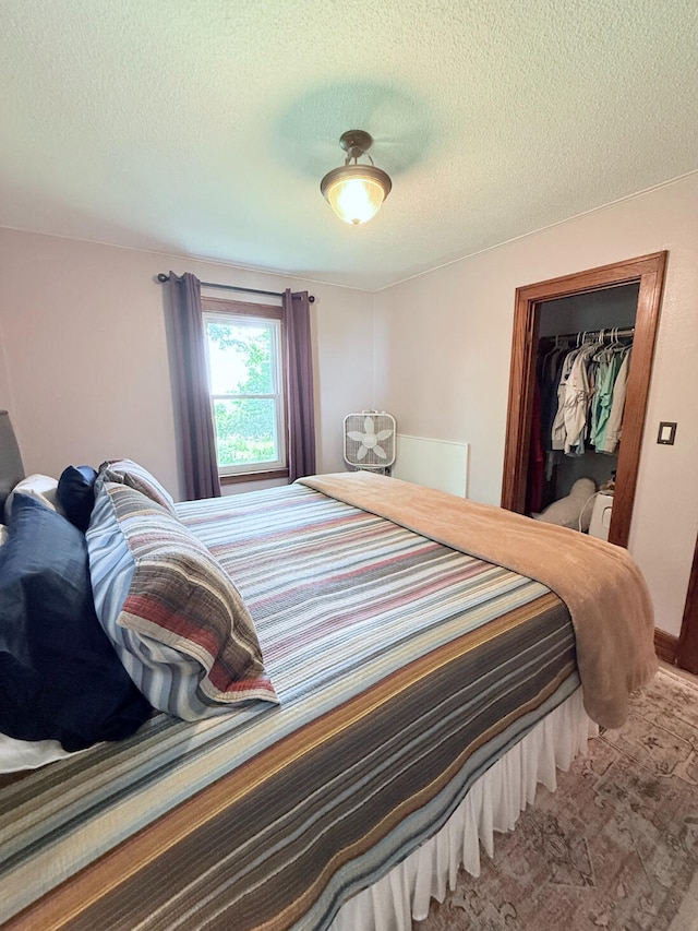 3628 Rau Rd, West Branch, MI 48661 - bedroom with a textured ceiling, a walk in closet, and a closet