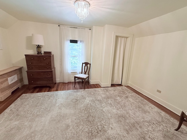 3628 Rau Rd, West Branch, MI 48661 - sitting room with wood finished floors, a chandelier, and lofted ceiling