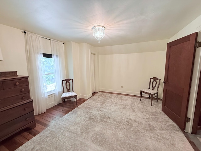 3628 Rau Rd, West Branch, MI 48661 - living area with dark wood finished floors and a chandelier