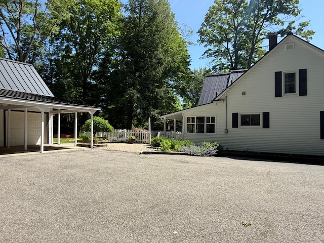 3628 Rau Rd, West Branch, MI 48661 - view of yard featuring a garage and driveway
