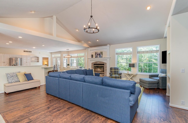 118 Frisco Dr, Houghton Lake, MI 48629 - living area featuring a chandelier, a fireplace, plenty of natural light, dark wood-type flooring, and recessed lighting