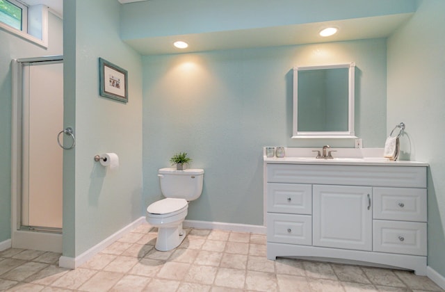 118 Frisco Dr, Houghton Lake, MI 48629 - bathroom featuring vanity, a shower stall, and recessed lighting