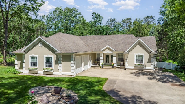 118 Frisco Dr, Houghton Lake, MI 48629 - single story home with stucco siding, a garage, driveway, a front lawn, and roof with shingles