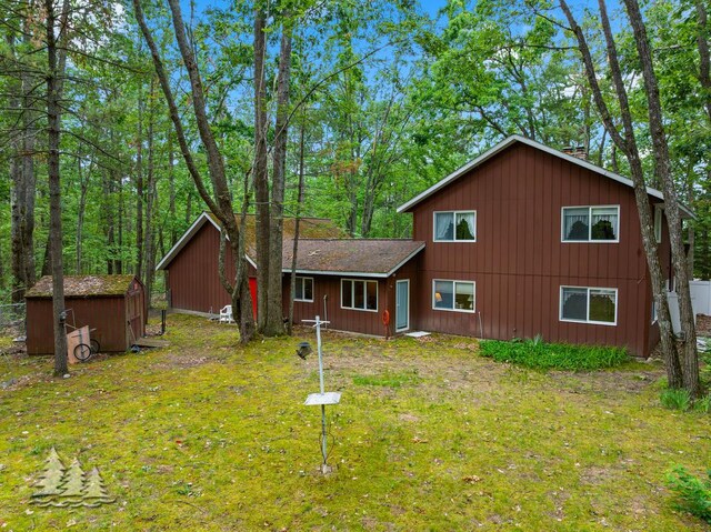 2801 Cobb Rd, Lewiston, MI 49756 - rustic home featuring a storage shed