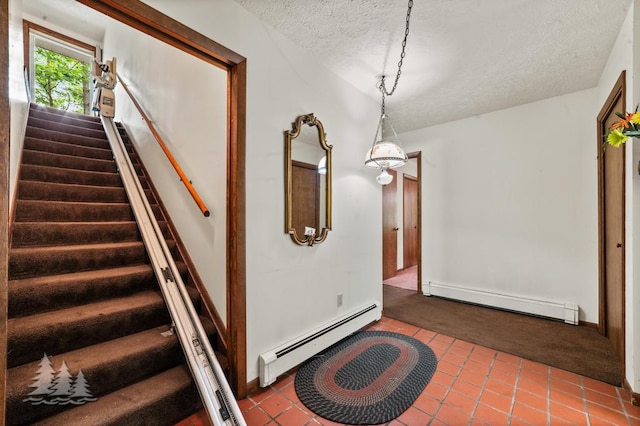 2801 Cobb Rd, Lewiston, MI 49756 - stairway featuring a baseboard radiator, a baseboard heating unit, carpet floors, a textured ceiling, and tile patterned floors