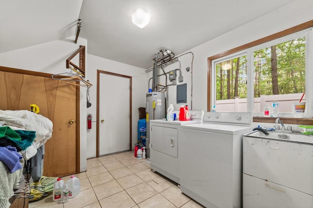 2801 Cobb Rd, Lewiston, MI 49756 - washroom with separate washer and dryer, water heater, light tile patterned floors, and electric panel