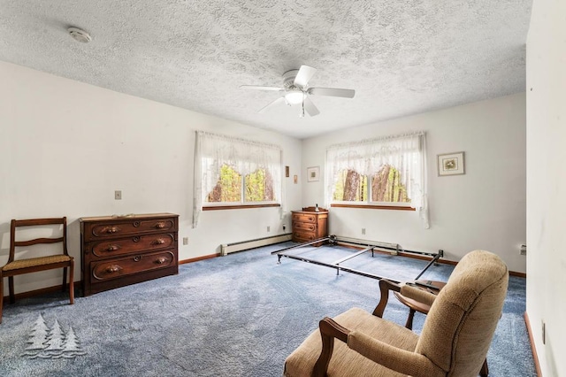 2801 Cobb Rd, Lewiston, MI 49756 - living area with baseboard heating, carpet, a ceiling fan, and a textured ceiling