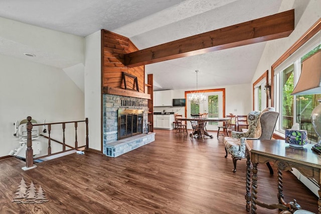 2801 Cobb Rd, Lewiston, MI 49756 - living area featuring plenty of natural light, dark wood-style flooring, a textured ceiling, and a fireplace