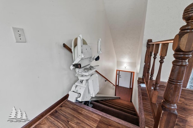 2801 Cobb Rd, Lewiston, MI 49756 - stairs featuring wood finished floors and baseboards