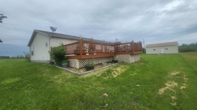 15135 M-32, Lachine, MI 49753 - back of house featuring a deck and a lawn