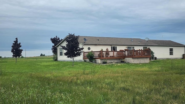 15135 M-32, Lachine, MI 49753 - rear view of property featuring a wooden deck and a yard