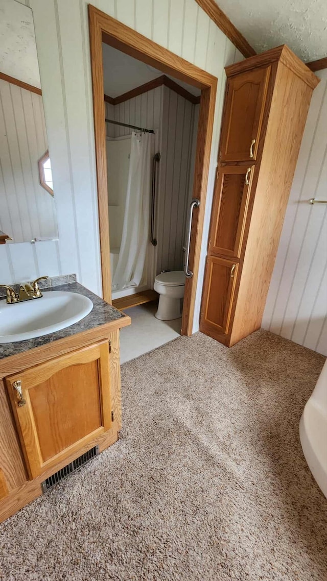 15135 M-32, Lachine, MI 49753 - full bathroom with vanity, carpet floors, crown molding, and wood walls