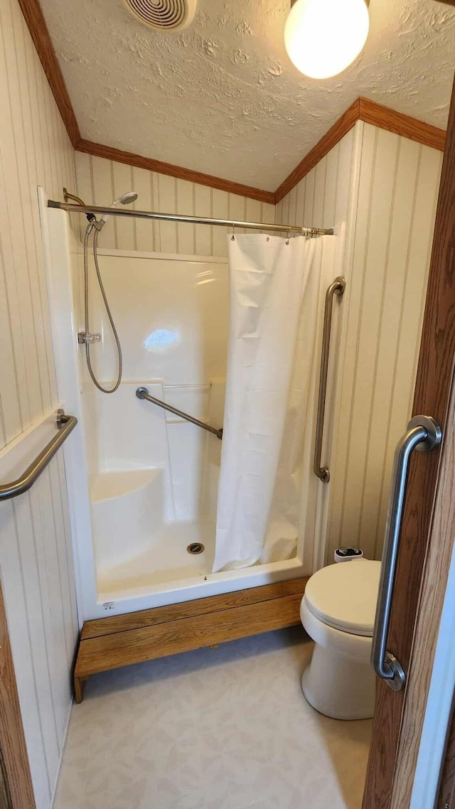 15135 M-32, Lachine, MI 49753 - bathroom featuring crown molding, curtained shower, a textured ceiling, and wooden walls