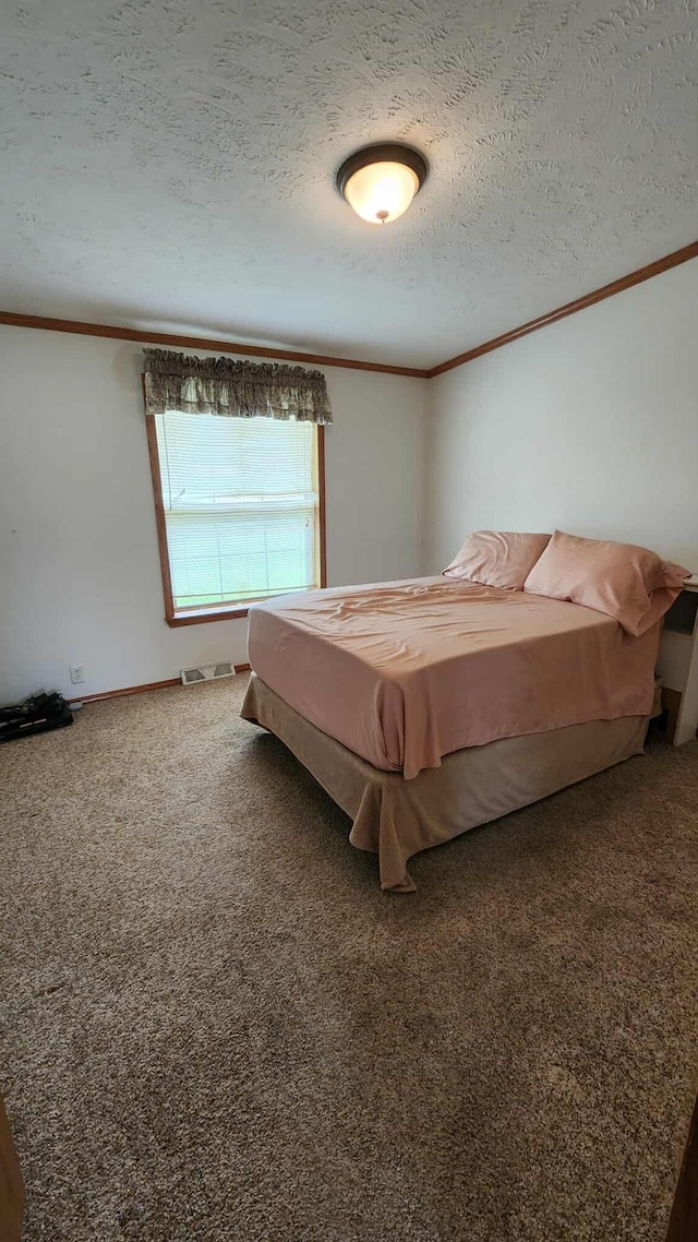 15135 M-32, Lachine, MI 49753 - bedroom with ornamental molding, a textured ceiling, and carpet floors