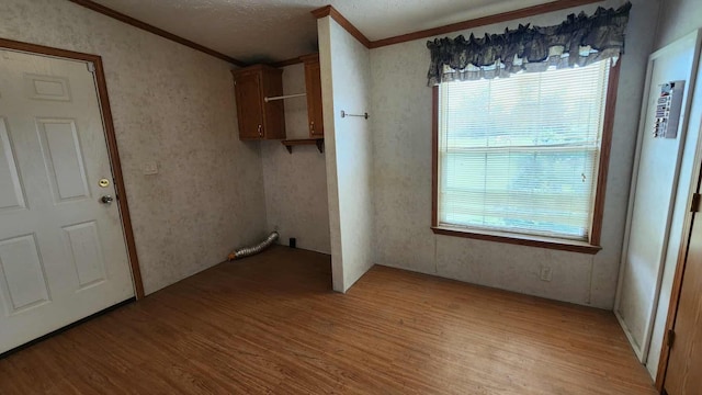15135 M-32, Lachine, MI 49753 - washroom with crown molding and light wood-style floors