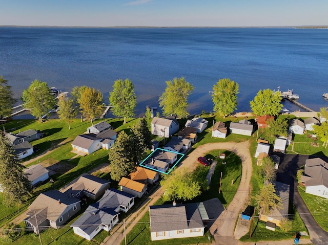 6390 W Houghton Lake Dr, Houghton Lake, MI 48629 - aerial perspective of suburban area featuring a large body of water and property parcel outlined