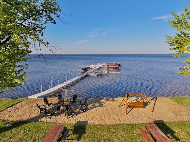 6390 W Houghton Lake Dr, Houghton Lake, MI 48629 - dock featuring a water view and a fire pit