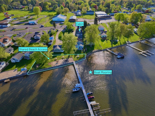 6390 W Houghton Lake Dr, Houghton Lake, MI 48629 - aerial perspective of suburban area with a large body of water