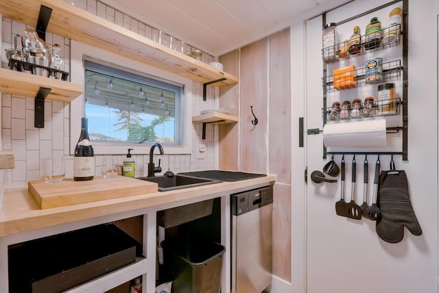 6390 W Houghton Lake Dr, Houghton Lake, MI 48629 - kitchen featuring open shelves, stainless steel dishwasher, and decorative backsplash