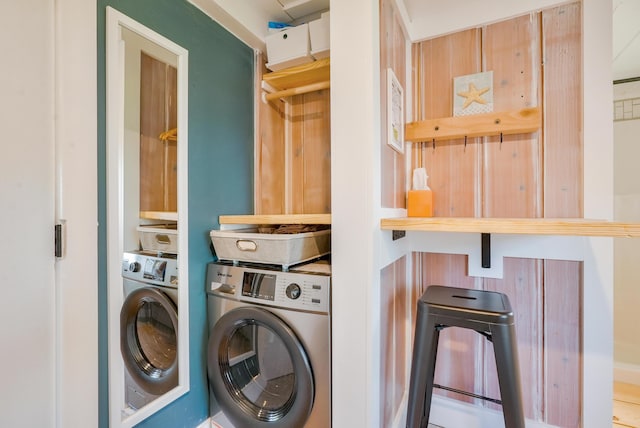 6390 W Houghton Lake Dr, Houghton Lake, MI 48629 - washroom with cabinet space and washing machine and dryer