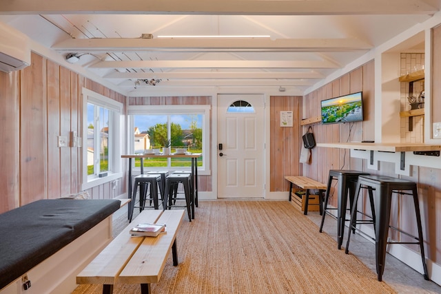 6390 W Houghton Lake Dr, Houghton Lake, MI 48629 - sunroom / solarium featuring an AC wall unit and beam ceiling