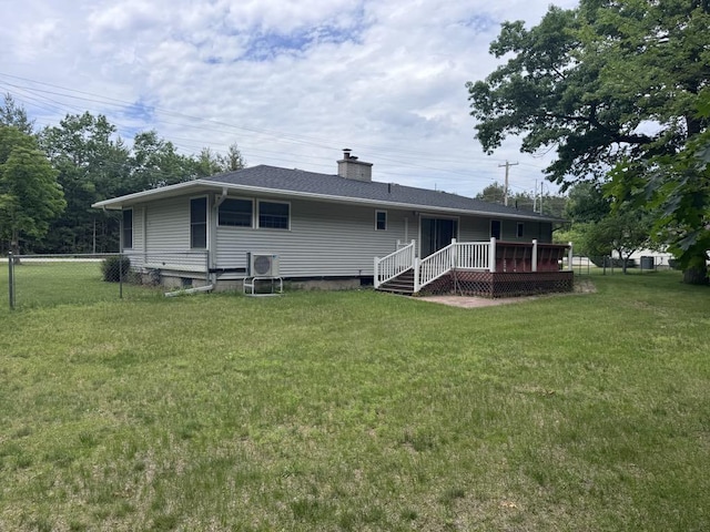 3011 Piper Rd, Alpena, MI 49707 - back of house with a wooden deck and a chimney