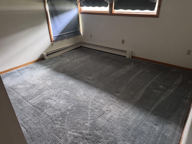 3011 Piper Rd, Alpena, MI 49707 - spare room featuring carpet flooring and baseboard heating