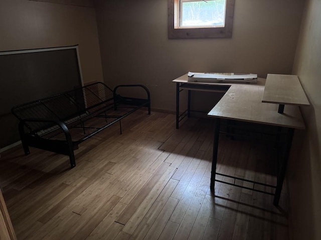 3011 Piper Rd, Alpena, MI 49707 - bedroom with wood-type flooring and baseboards