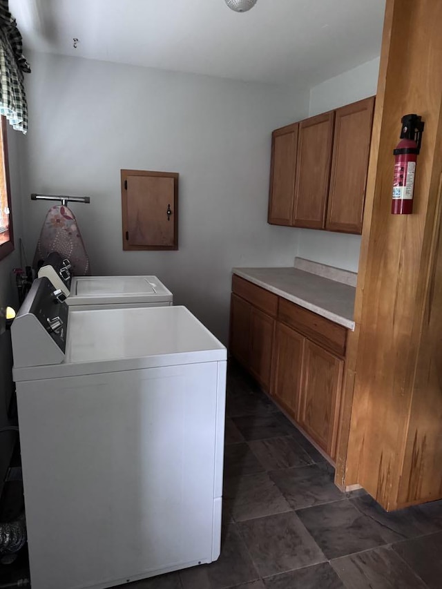 3011 Piper Rd, Alpena, MI 49707 - laundry area with cabinet space and washing machine and clothes dryer