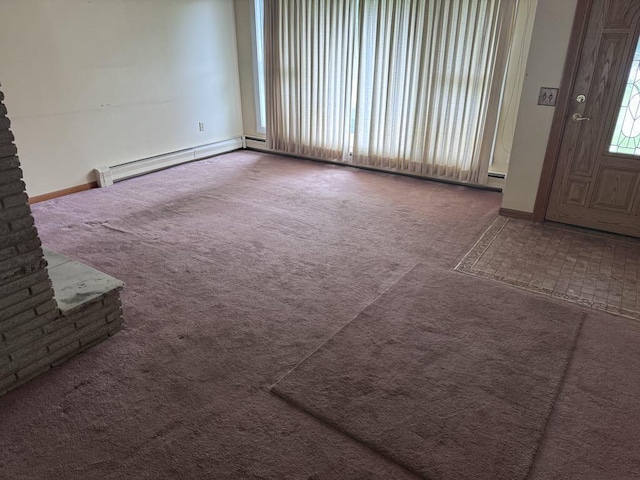 3011 Piper Rd, Alpena, MI 49707 - carpeted spare room with baseboards and a baseboard heating unit