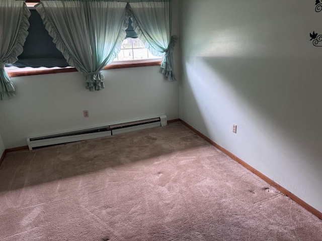 3011 Piper Rd, Alpena, MI 49707 - empty room featuring baseboard heating and carpet