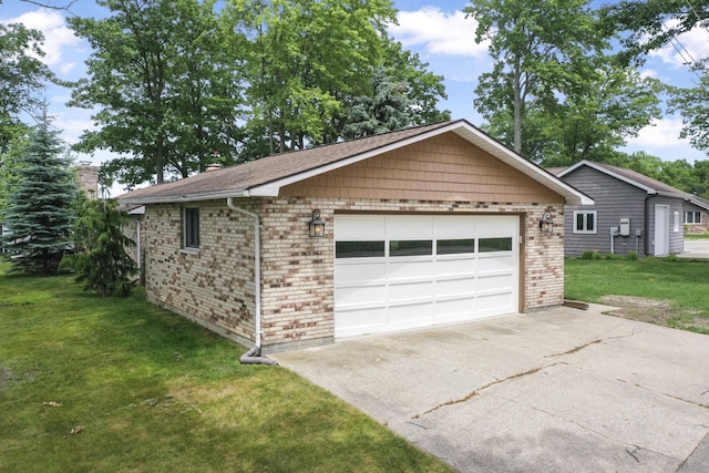 802 Houghton View Dr, Prudenville, MI 48651 - view of front facade with driveway, brick siding, an outbuilding, and a front yard
