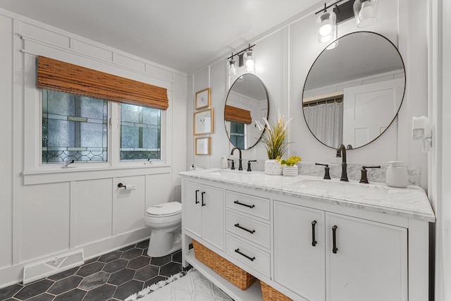 802 Houghton View Dr, Prudenville, MI 48651 - bathroom featuring double vanity and tile patterned floors
