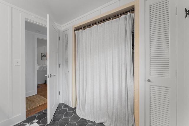 802 Houghton View Dr, Prudenville, MI 48651 - full bath with a closet, tile patterned floors, and a shower with curtain