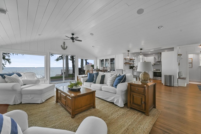 802 Houghton View Dr, Prudenville, MI 48651 - living room featuring a ceiling fan, a water view, wood finished floors, lofted ceiling, and wooden ceiling