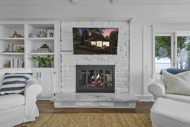 802 Houghton View Dr, Prudenville, MI 48651 - living area featuring wood finished floors and a fireplace