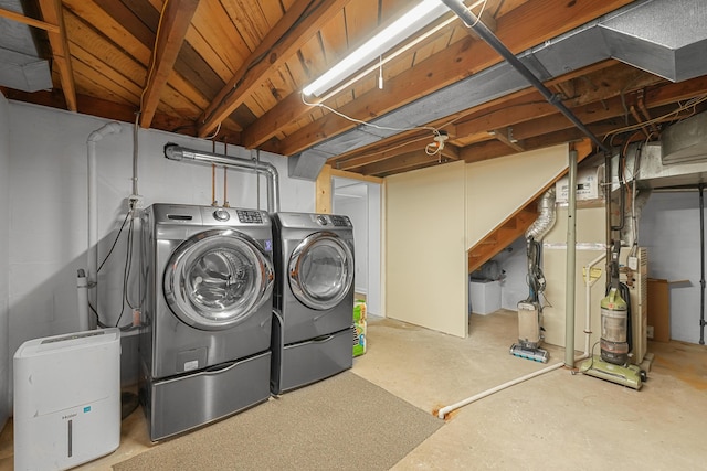802 Houghton View Dr, Prudenville, MI 48651 - unfinished basement featuring washer and dryer