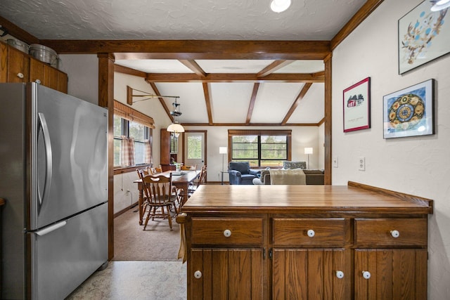 6612 Old Vanderbilt Rd, Vanderbilt, MI 49795 - kitchen with freestanding refrigerator, wood counters, brown cabinetry, open floor plan, and a textured ceiling