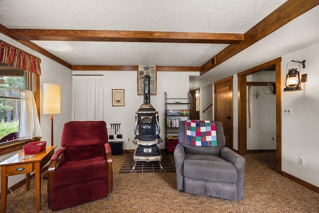 6612 Old Vanderbilt Rd, Vanderbilt, MI 49795 - living room featuring beamed ceiling, carpet, and a textured ceiling