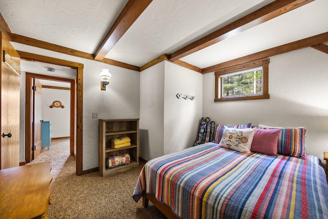 6612 Old Vanderbilt Rd, Vanderbilt, MI 49795 - carpeted bedroom with beam ceiling and a textured wall