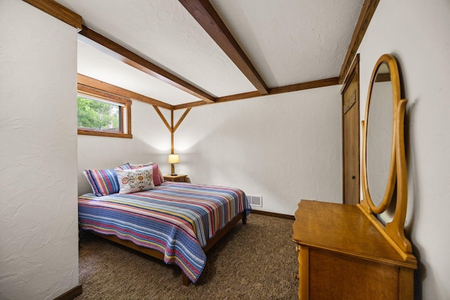 6612 Old Vanderbilt Rd, Vanderbilt, MI 49795 - carpeted bedroom featuring a textured wall and beam ceiling
