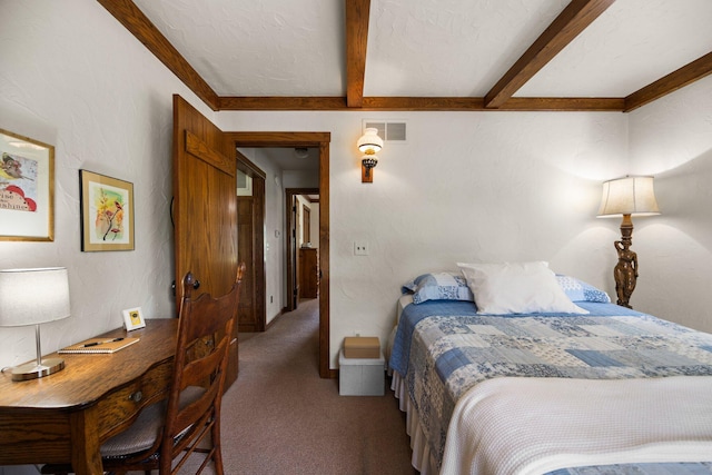 6612 Old Vanderbilt Rd, Vanderbilt, MI 49795 - bedroom with carpet floors and beamed ceiling