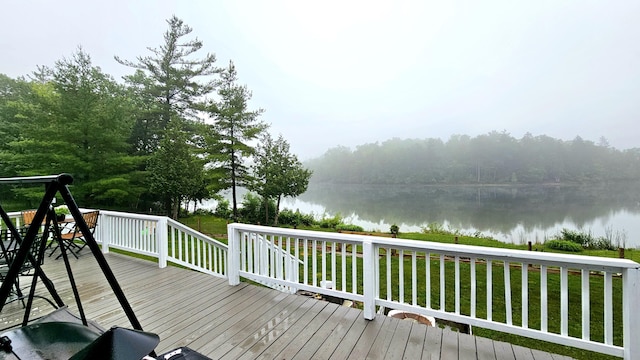 7717 Weiss Rd, Alpena, MI 49707 - wooden deck featuring a water view and a lawn
