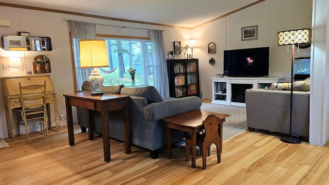7717 Weiss Rd, Alpena, MI 49707 - living room featuring crown molding and light wood finished floors