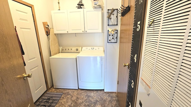 7717 Weiss Rd, Alpena, MI 49707 - laundry area with cabinet space, independent washer and dryer, and a heating unit