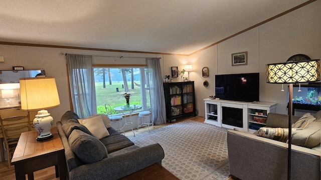 7717 Weiss Rd, Alpena, MI 49707 - living room with crown molding, vaulted ceiling, and wood finished floors