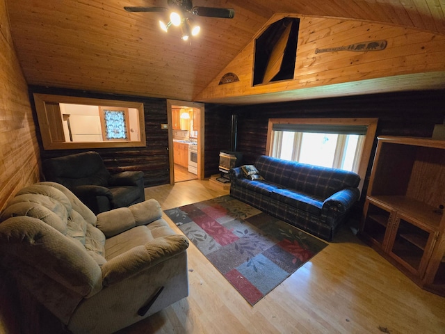 2880 Ann Arbor Rd, Lewiston, MI 49756 - living room featuring ceiling fan, wood walls, wood finished floors, wood ceiling, and high vaulted ceiling