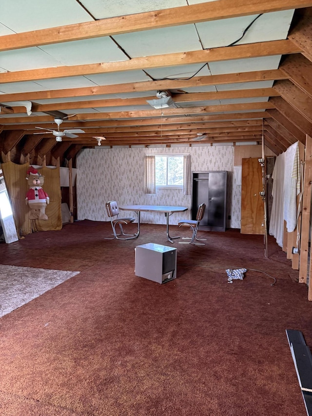 2493 S Horseshoe Trl, Grayling, MI 49738 - living room featuring ceiling fan, dark colored carpet, and wallpapered walls