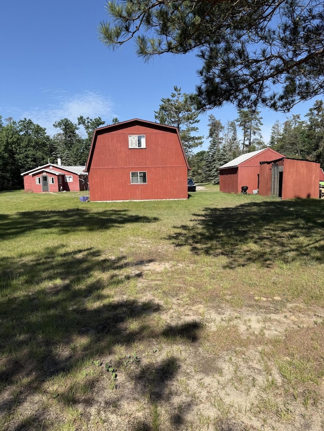 2493 S Horseshoe Trl, Grayling, MI 49738 - view of grassy yard with a pole building and an outbuilding